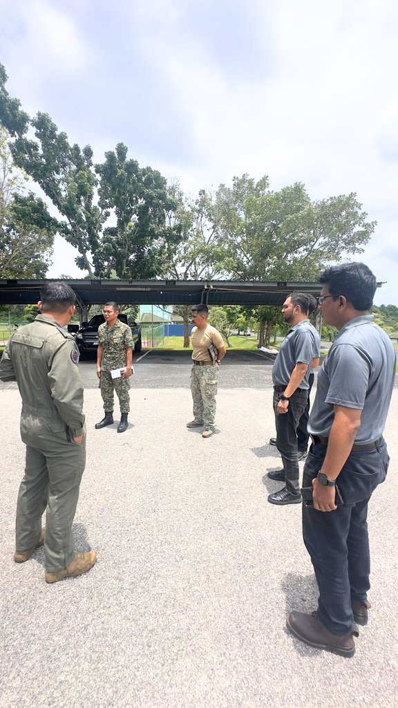 On-site briefing with uniformed personnel